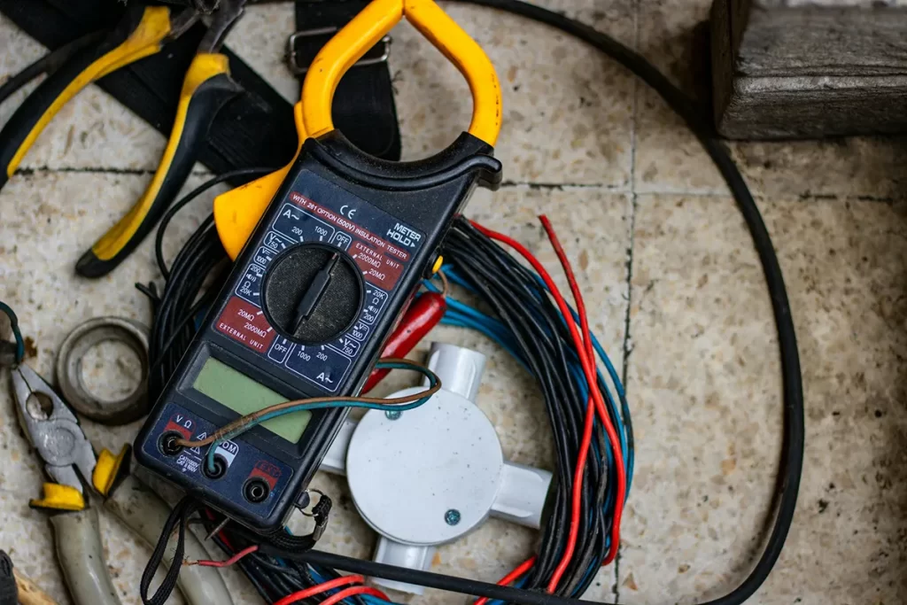 Electrical testing equipment and wiring setup, illustrating the precision and expertise involved in electrician jobs Hamilton.