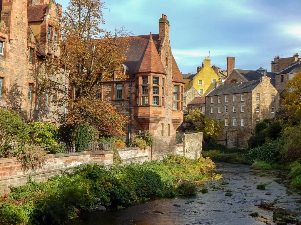 Peaceful Scottish village by a river, highlighting the rural opportunities available for gas engineer jobs Scotland.