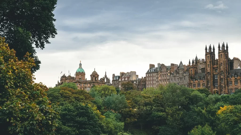 View of Edinburgh’s historic building from a park, representing opportunities and growth for professionals seeking CNC's Jobs Edinburgh.